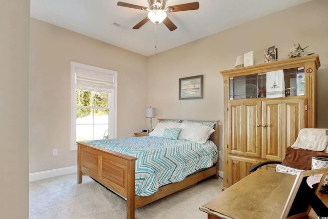 bedroom featuring ceiling fan and light colored carpet