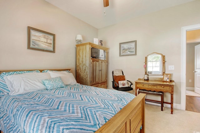 carpeted bedroom featuring ceiling fan and lofted ceiling