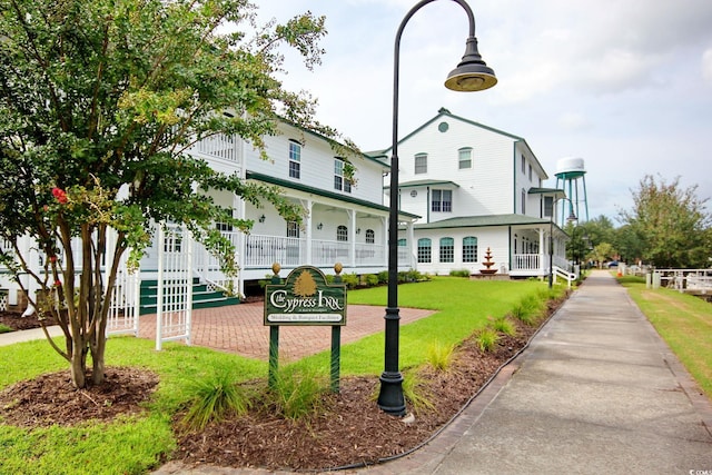 view of community featuring a lawn