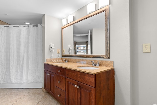 bathroom featuring tile patterned floors, vanity, and shower / bath combination with curtain