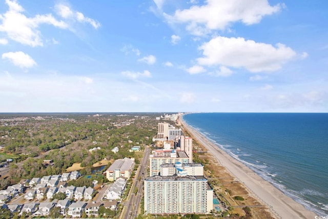 bird's eye view with a water view and a beach view