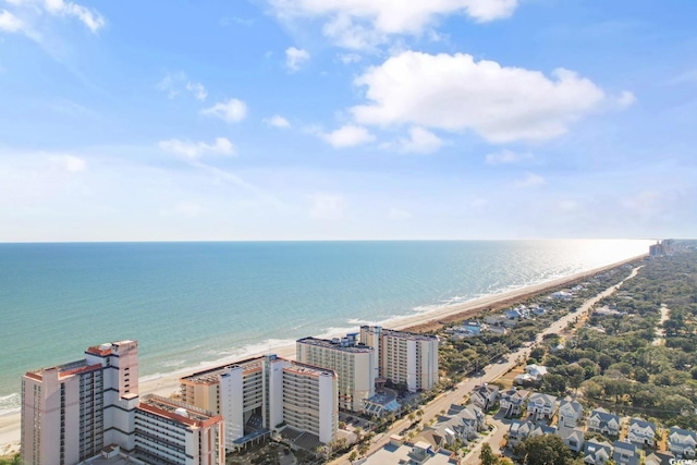 drone / aerial view featuring a water view and a beach view