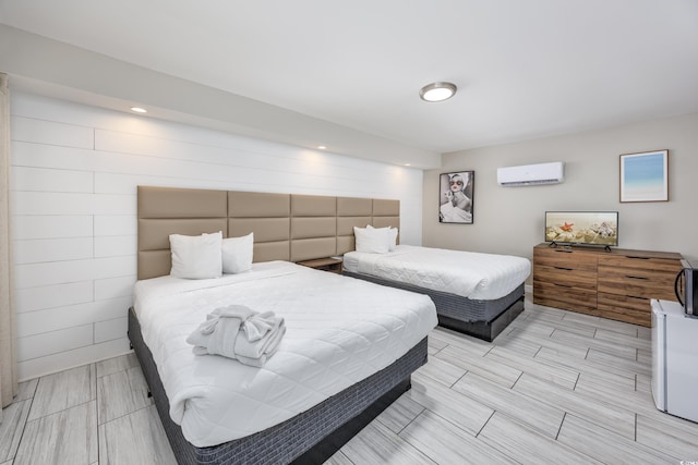 bedroom featuring an AC wall unit