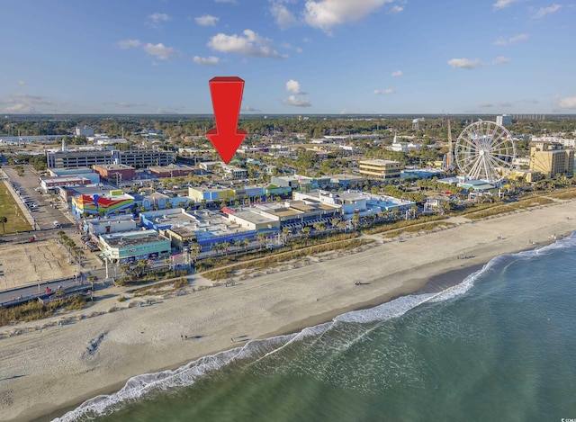 bird's eye view with a water view and a view of the beach