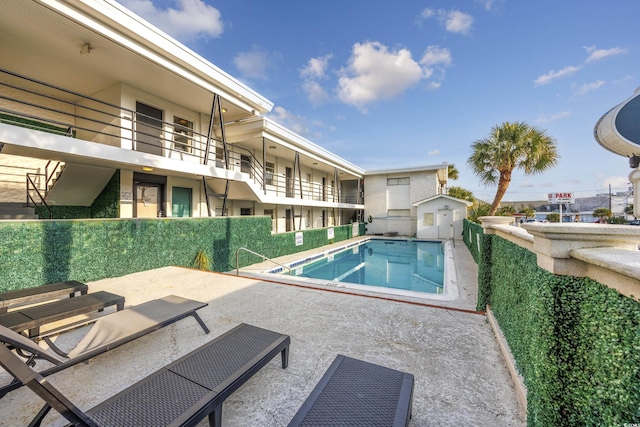 view of swimming pool with a patio area