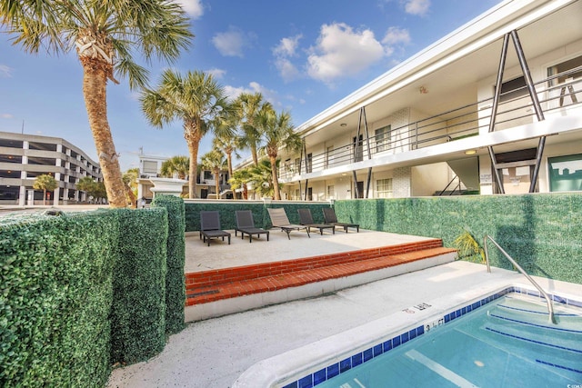 view of swimming pool with a patio