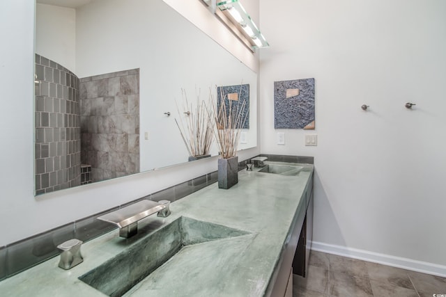 bathroom with tile patterned floors and vanity