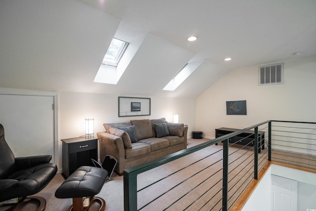 carpeted living room featuring vaulted ceiling