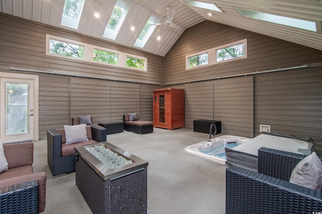 view of patio with an outdoor living space with a fire pit