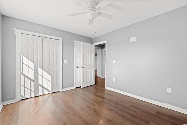 unfurnished bedroom with ceiling fan and wood-type flooring