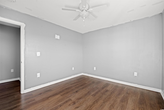 unfurnished room with ceiling fan and dark wood-type flooring