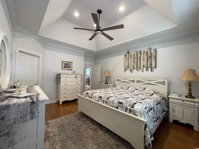 bedroom with ornamental molding, wood finished floors, recessed lighting, a raised ceiling, and a ceiling fan