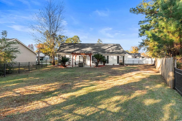 rear view of house with a patio area and a yard