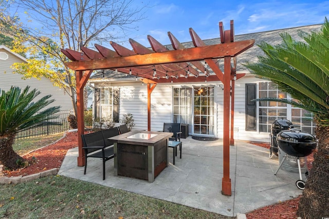 view of patio featuring a fire pit and a pergola