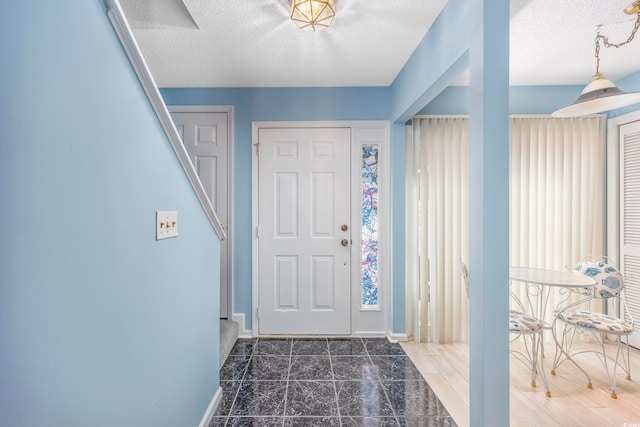 entrance foyer featuring a textured ceiling