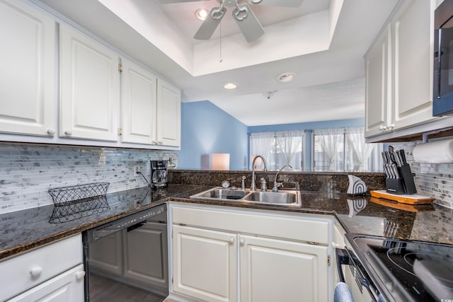 kitchen featuring white cabinets, dishwasher, dark stone countertops, and sink