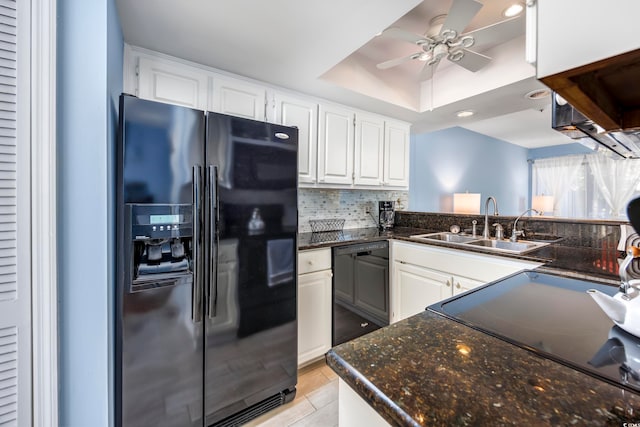 kitchen with sink, tasteful backsplash, white cabinetry, and black appliances