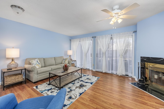 86 Shadow Moss Pl Unit 86, North Myrtle Beach, SC 29582 - living room featuring ceiling fan, wood finished floors, and a textured ceiling