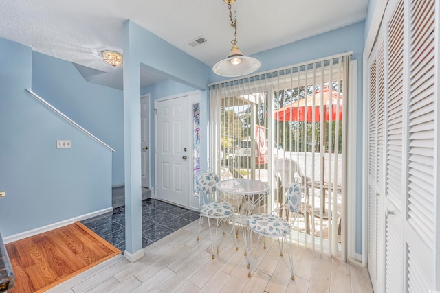 foyer entrance with hardwood / wood-style floors