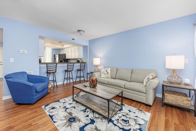 86 Shadow Moss Pl Unit 86, North Myrtle Beach, SC 29582 - living room featuring wood finished floors and baseboards