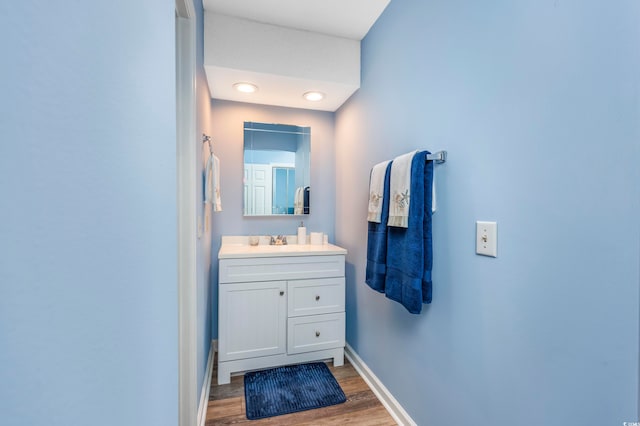 bathroom featuring vanity and wood-type flooring