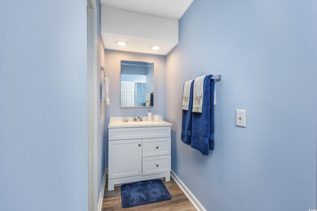 86 Shadow Moss Pl Unit 86, North Myrtle Beach, SC 29582 - bathroom with wood finished floors, vanity, and baseboards