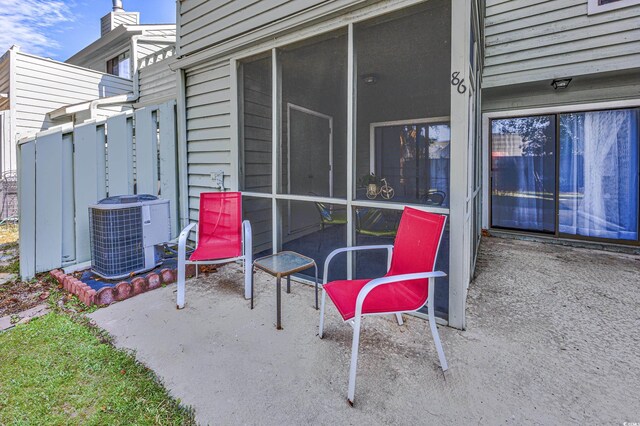 86 Shadow Moss Pl Unit 86, North Myrtle Beach, SC 29582 - view of patio / terrace with central AC unit and a sunroom