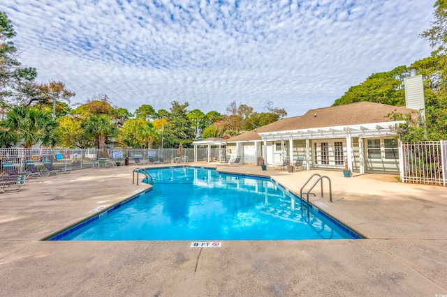 view of swimming pool with a pergola and a patio area