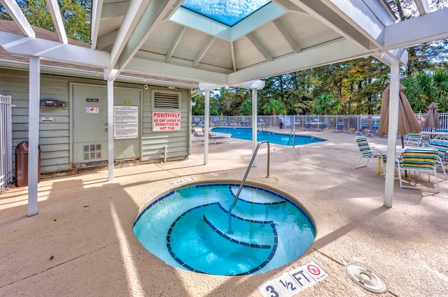 view of swimming pool with a patio area