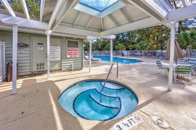 86 Shadow Moss Pl Unit 86, North Myrtle Beach, SC 29582 - community pool featuring a hot tub and a patio