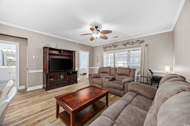 living room with ceiling fan, light wood-type flooring, and crown molding