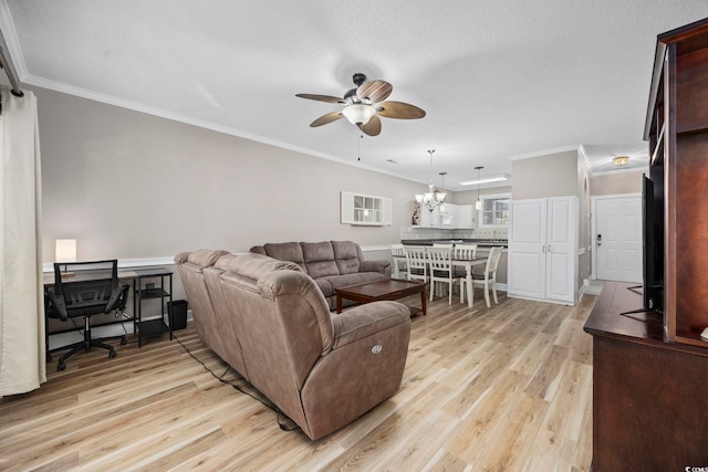 living room with a textured ceiling, crown molding, light hardwood / wood-style floors, and ceiling fan with notable chandelier