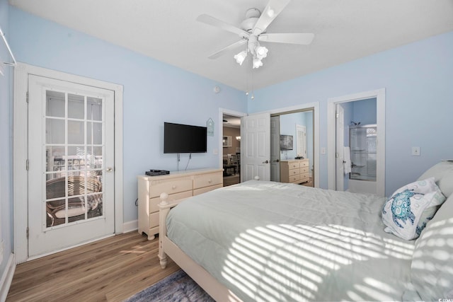 bedroom featuring hardwood / wood-style floors, ensuite bath, and ceiling fan