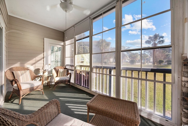 sunroom / solarium with ceiling fan and a healthy amount of sunlight