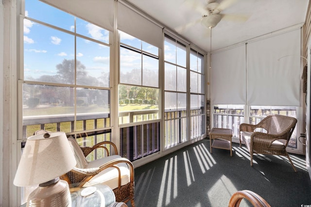 sunroom / solarium featuring ceiling fan