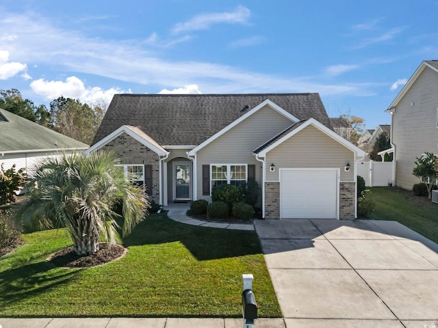 view of front of house featuring a garage and a front yard