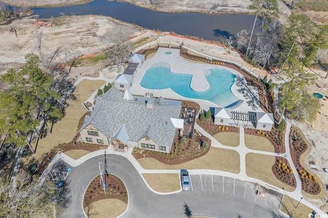 birds eye view of property with a water view