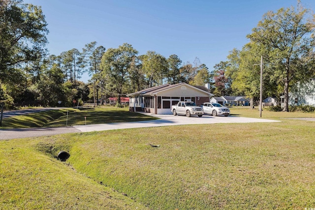 view of home's community featuring a yard