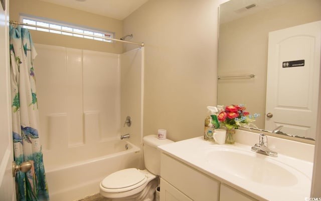 full bathroom with shower / tub combo, vanity, and toilet