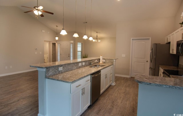 kitchen featuring a kitchen island with sink, white cabinetry, pendant lighting, and stainless steel appliances