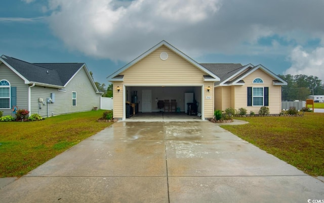 view of front of house with a front lawn and a garage