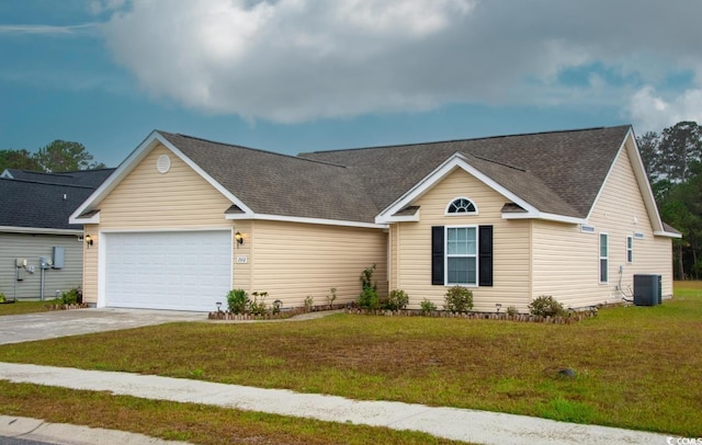 ranch-style home featuring central AC unit, a front yard, and a garage