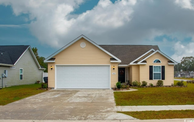 view of front of property featuring a front lawn and a garage