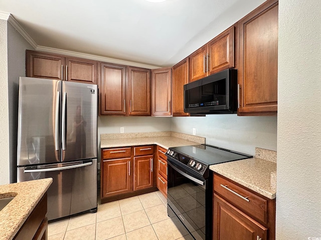 kitchen with crown molding, light tile patterned floors, black appliances, and light stone counters