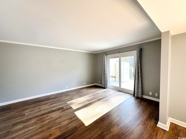 unfurnished room with crown molding and dark wood-type flooring