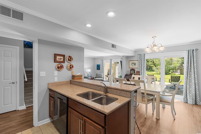 1100 Wedge Way Unit 67, Little River, SC 29566 - kitchen featuring a sink, black dishwasher, crown molding, recessed lighting, and a chandelier