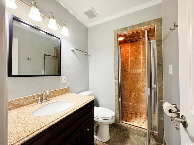 bathroom featuring vanity, crown molding, tile patterned flooring, toilet, and an enclosed shower