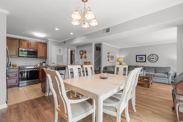 1100 Wedge Way Unit 67, Little River, SC 29566 - dining space with crown molding, a chandelier, light wood-style floors, and recessed lighting