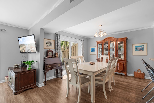 1100 Wedge Way Unit 67, Little River, SC 29566 - dining room with a chandelier, wood finished floors, ornamental molding, and baseboards