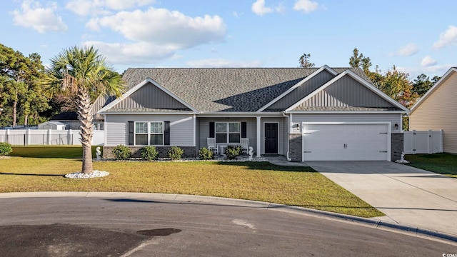 view of front of property with a garage and a front yard